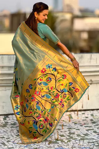 Light green with multicolor accents  woven zari floral & peacock motifs  silk blend  