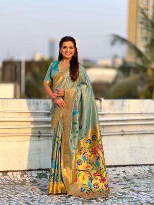 Light green with multicolor accents  woven zari floral & peacock motifs  silk blend   3