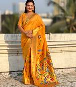 Yellow with multicolor accents  woven zari floral & peacock motifs  silk blend  