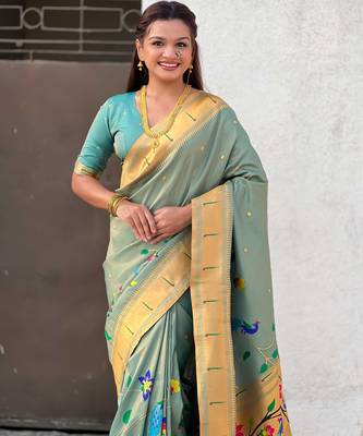 Light green with multicolor accents  woven zari floral & peacock motifs  silk blend   5