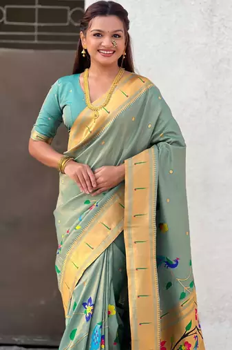 Light green with multicolor accents  woven zari floral & peacock motifs  silk blend  