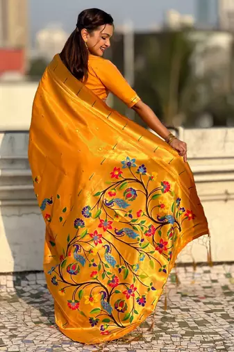 Yellow with multicolor accents  woven zari floral & peacock motifs  silk blend  
