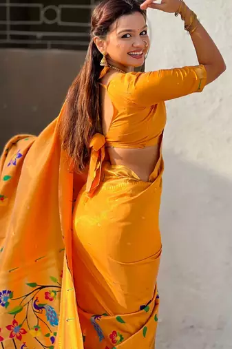 Yellow with multicolor accents  woven zari floral & peacock motifs  silk blend  