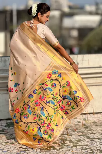 Off white with multicolor accents  woven zari floral & peacock motifs  silk blend