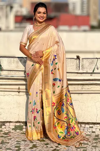 Off white with multicolor accents  woven zari floral & peacock motifs  silk blend