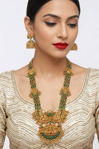 Stunning gold-plated temple jewelry set with emeralds | traditional haram & jhumkas | bridal & festival wear