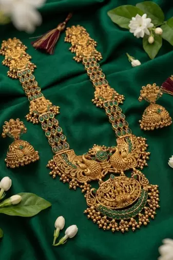 Stunning gold-plated temple jewelry set with emeralds | traditional haram & jhumkas | bridal & festival wear