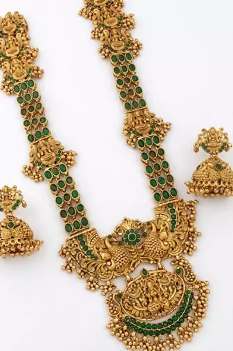 Stunning gold-plated temple jewelry set with emeralds | traditional haram & jhumkas | bridal & festival wear