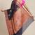Banarasi silk blend saree in black  colour with copper zari floral  work