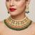Exquisite gold-plated kundan bridal choker set with emerald green beads - traditional ethnic indian jewelry