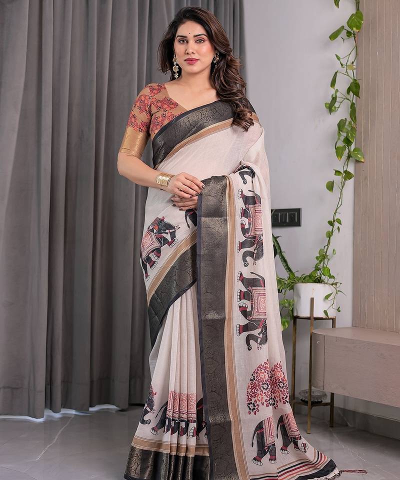 Designer floral print handloom linen weaved with golden zari saree with tassel pallu & blouse