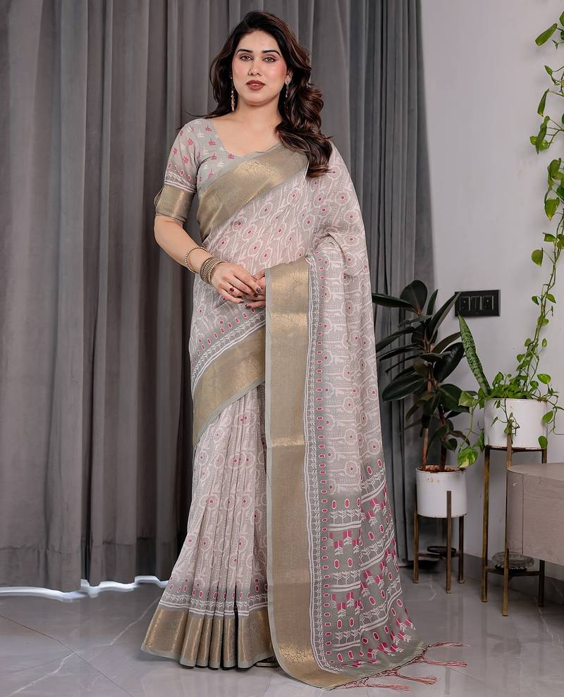 Handloom linen weaved with golden zari floral printed saree with tassels & attached blouse     5.5m