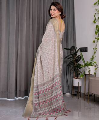 Handloom linen weaved with golden zari floral printed saree with tassels & attached blouse     5.5m 4