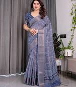 Traditional handloom linen weaved with golden zari floral saree with matching blouse & tassel detailing