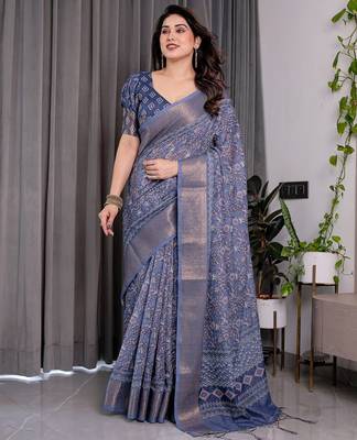 Traditional handloom linen weaved with golden zari floral saree with matching blouse & tassel detailing 2