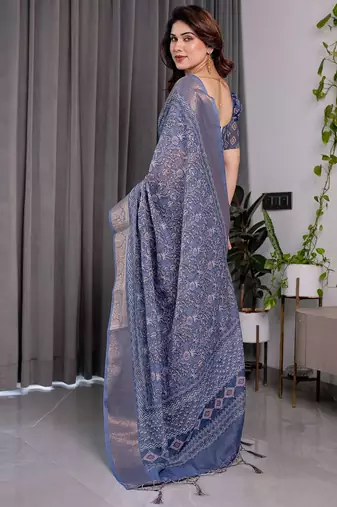 Traditional handloom linen weaved with golden zari floral saree with matching blouse & tassel detailing