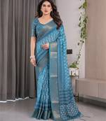 Linen weaved with golden zari handloom saree with digital floral print and tassels     festive wear