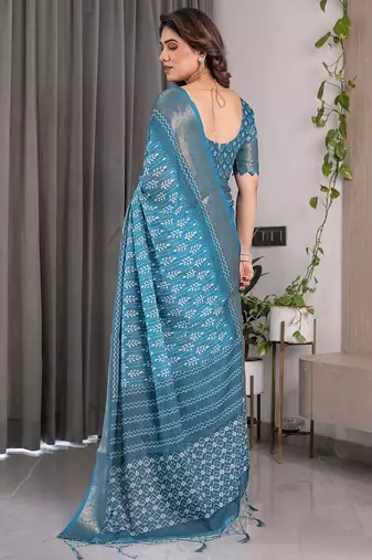 Linen weaved with golden zari handloom saree with digital floral print and tassels     festive wear