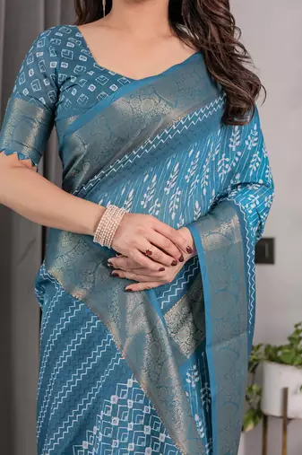 Linen weaved with golden zari handloom saree with digital floral print and tassels     festive wear