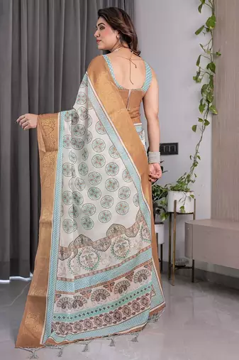 Soft handloom linen weaved with golden zari saree with multicolor floral print and tassel edges