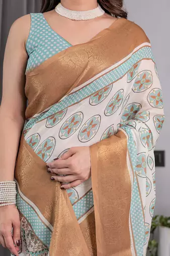 Soft handloom linen weaved with golden zari saree with multicolor floral print and tassel edges
