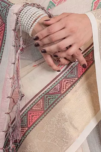 Elegant handloom linen weaved with golden zari saree with floral print & tassel edges     5.5m + 0.8m blouse