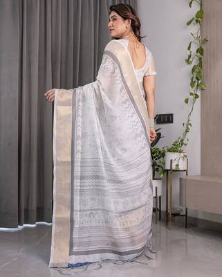 Floral printed linen weaved with golden zari saree in handloom weave with blouse piece     5.5m 3