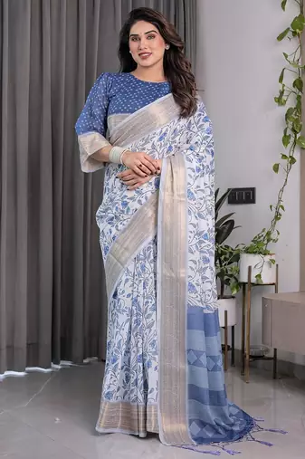 Traditional handloom linen weaved with golden zari floral saree with matching blouse & tassel detailing