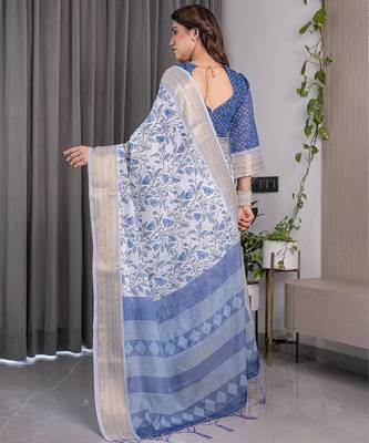 Traditional handloom linen weaved with golden zari floral saree with matching blouse & tassel detailing 3