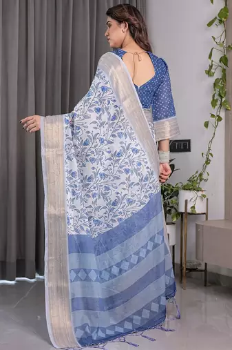 Traditional handloom linen weaved with golden zari floral saree with matching blouse & tassel detailing