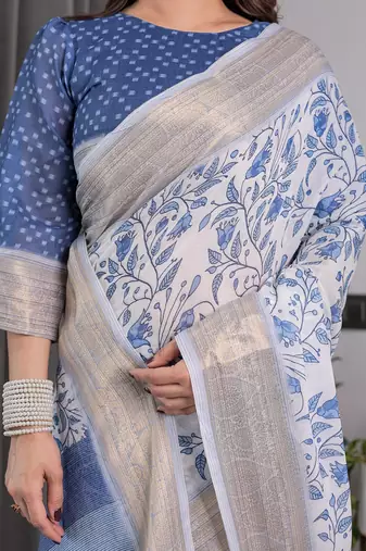 Traditional handloom linen weaved with golden zari floral saree with matching blouse & tassel detailing
