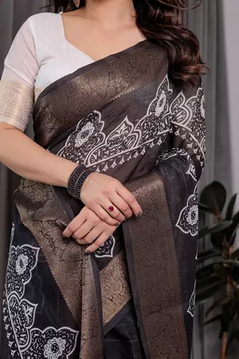 Soft handloom linen weaved with golden zari floral saree with tassels     includes 0.8m blouse