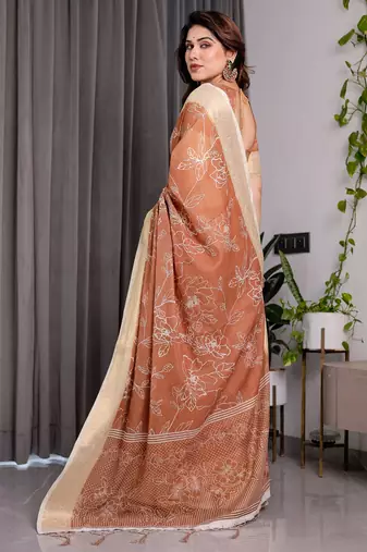 Graceful handloom linen weaved with golden zari saree with artistic floral print & tassels
