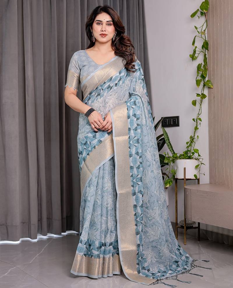 Linen weaved with golden zari handloom saree with digital floral print and tassels     festive wear