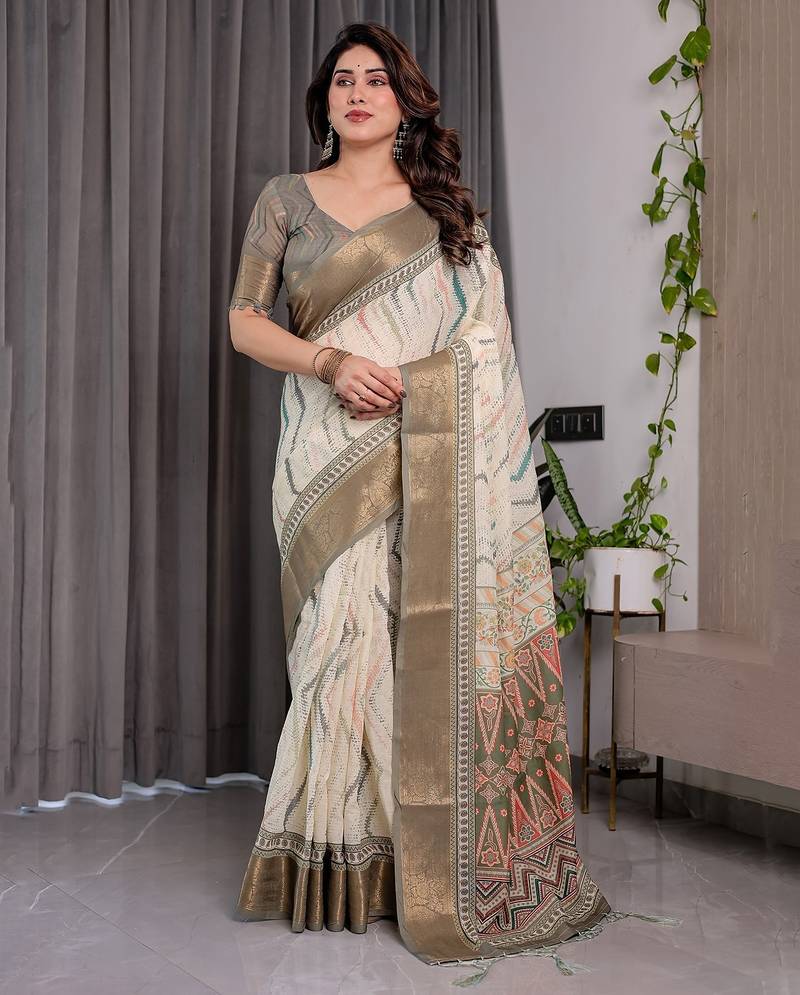 Handloom linen weaved with golden zari floral printed saree with tassels & attached blouse     5.5m
