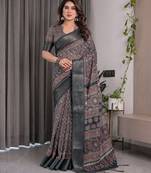 Graceful handloom linen weaved with golden zari saree with artistic floral print & tassels