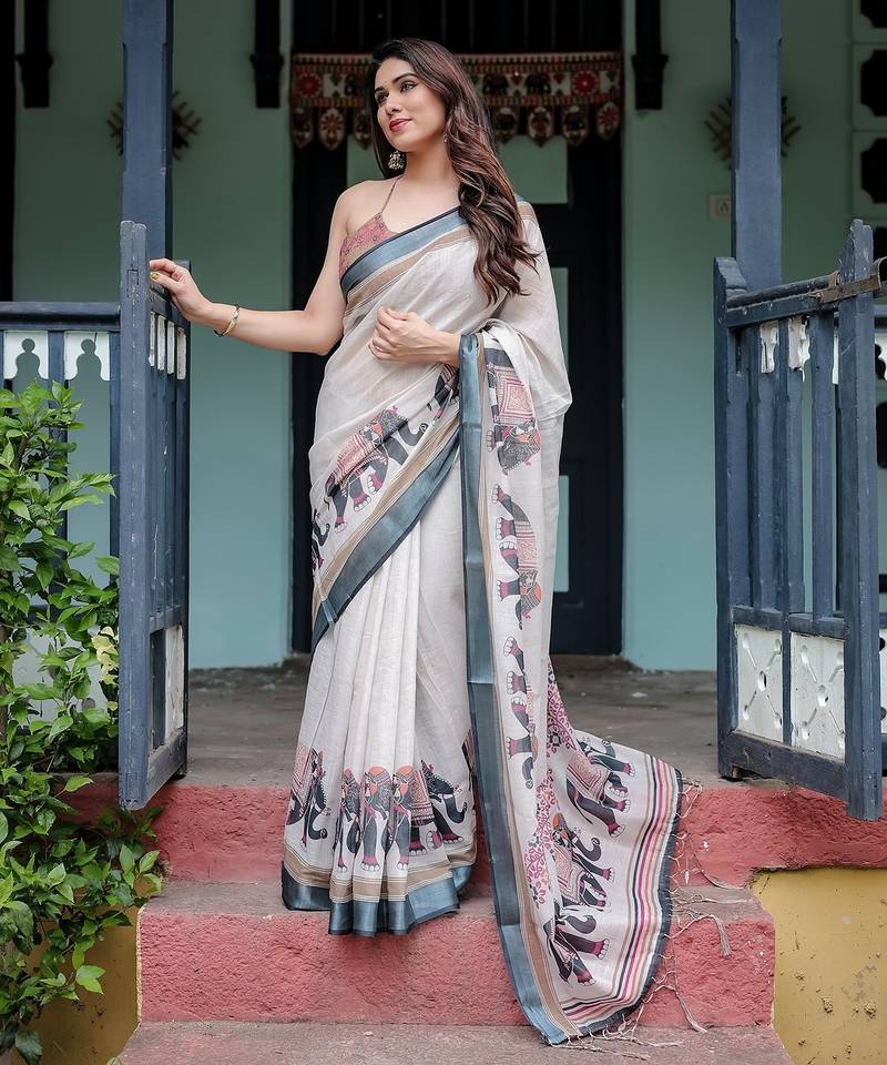 Designer floral print handloom linen saree with tassel pallu & blouse