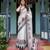 Designer floral print handloom linen saree with tassel pallu & blouse