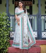 Graceful handloom linen saree with artistic floral print & tassels