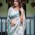 Graceful handloom linen saree with artistic floral print & tassels