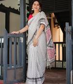 Soft handloom linen saree with multicolor floral print and tassel edges
