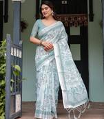 Elegant handloom linen saree with floral print & tassel edges     5.5m + 0.8m blouse