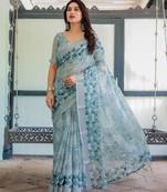 Traditional handloom linen floral saree with matching blouse & tassel detailing