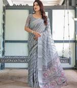 Printed floral handloom linen saree with stylish tassel finish     ready to wear