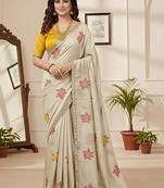 Off white star georgette floral motifs embroidered work saree with mirror work border