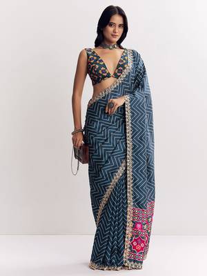 Teal blue manipuri zigzag pattern leheriya printed saree with embroidery work lace 1