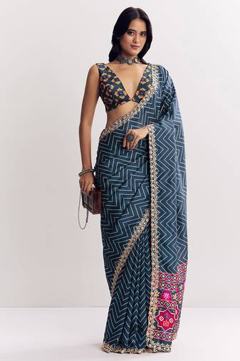 Teal blue manipuri zigzag pattern leheriya printed saree with embroidery work lace