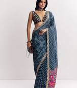 Teal blue manipuri zigzag pattern leheriya printed saree with embroidery work lace