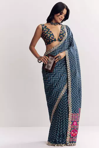 Teal blue manipuri zigzag pattern leheriya printed saree with embroidery work lace