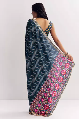 Teal blue manipuri zigzag pattern leheriya printed saree with embroidery work lace